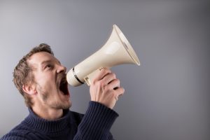 Man shouting into a megaphone